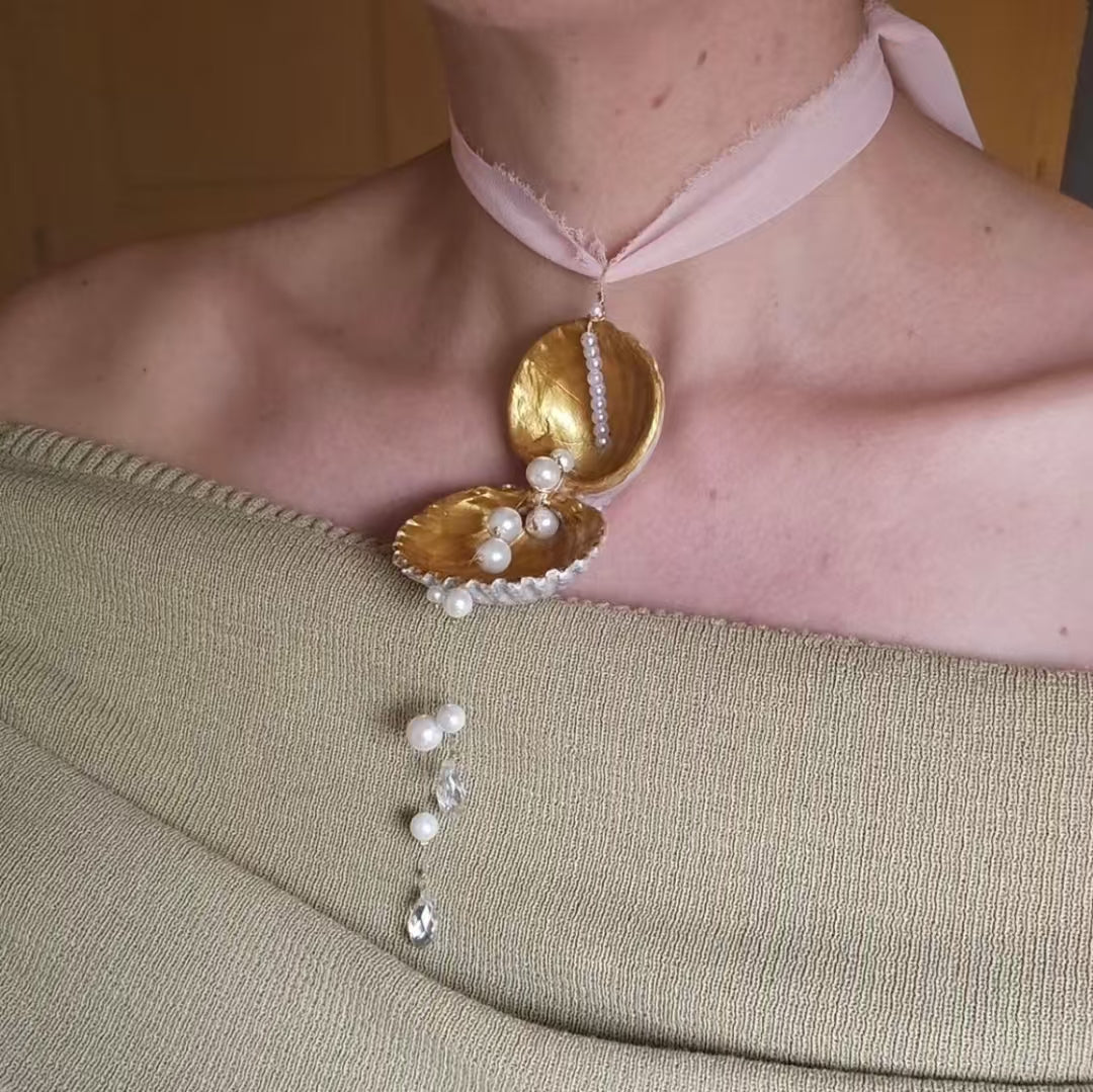 A necklace with a unique shell design feel